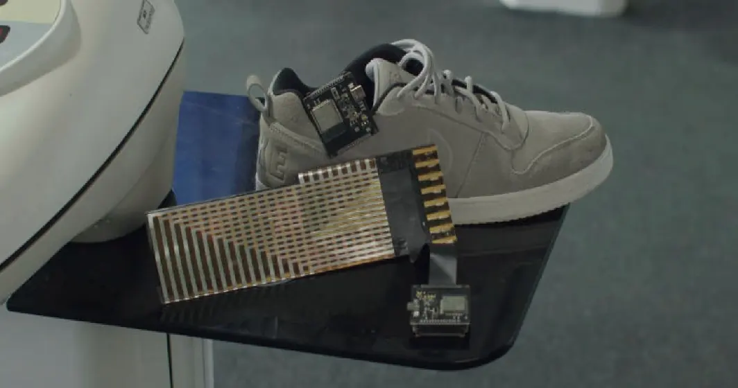 An early sensor strip taped into a running shoe