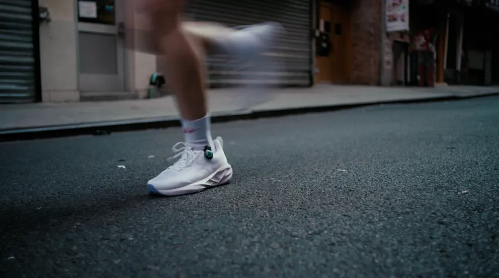 A runner on the street wearing STRIV