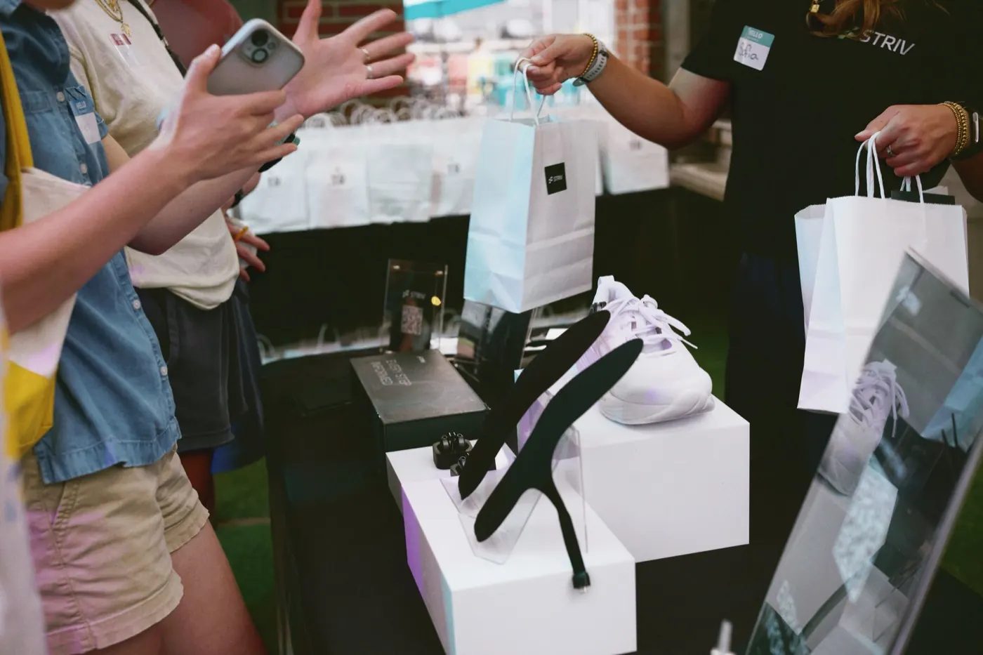 STRIV insoles on the demo table at a community run event