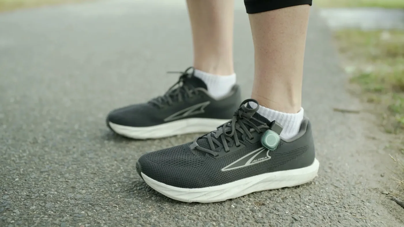 STRIV pods clipped onto a pair of running shoes